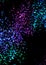 Colorful abstract paint spatter or spray on black background in blue green pink and purple color splash, paint spots and dots are