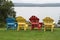 Colorful Adirondack chairs looking out on the lake