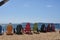 Colorful Adirondack Chairs on a Sandy Beach