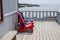 Colorful Adirondack deck and beach chairs in bright red and brig