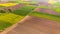 Colorful agriculture farmland at spring, aerial drone view