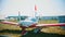 A colorful airplane with front valve - an outdoors airplane exposition - summer