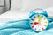 Colorful alarm clock on bed