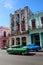Colorful Almendrones, old Cars in a large avenue in La Havana, Cuba, with colorful buildings