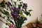 colorful amazing wildflowers in vase on background of rustic room