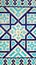 Colorful ancient traditional Uzbek pattern on the ceramic tile on the wall of the mosque