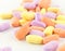 Colorful antibiotic tablets on white