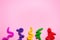 Colorful antistress children toys on pink paper with large copy space