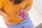 Colorful antistress sensory toy fidget push pop it in toddler& x27;s hands. Antistress trendy pop it toy. Rainbow sensory