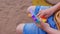 Colorful antistress sensory toy fidget push pop it in toddler's hands. Antistress trendy pop it toy. Rainbow sensory