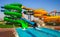 Colorful aquapark slide with pool for everyone. Happy holidays on vacation