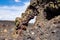 Colorful arch formation in volcanic rock at Craters of the Moon National Monument along Spatter Cones trail