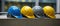 Colorful array of hardhats, crucial protective gear for construction workers. Concept of construction industry protection and