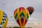 Colorful array of hot air balloons float through the sky at dusk at Warren County Farmer`s Fair on 8/1/17