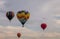 Colorful array of hot air balloons float through the sky at dusk at Warren County Farmer`s Fair on 8/1/17