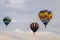 Colorful array of hot air balloons float through the sky at dusk at Warren County Farmer`s Fair, Harmony, New Jersey, on 8/1/17