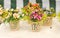 Colorful artificial flowers decorations. Decorative arrangement of various flowers at Romanian market