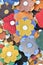 Colorful artificial flowers decorations. Decorative arrangement of various flowers at Romanian market. Colorful textile flowers