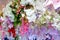 Colorful artificial paper flowers hanging on a stage.