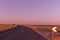 Colorful asphalt curved road with fields view in countryside on sunset , sunny day