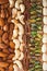 Colorful assorted nuts background - almonds, cashews, pistachios, white almonds texture