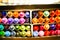 Colorful assortment of crayons in a shelf for a vibrant background or wallpaper