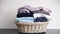 Colorful assortment of folded clothes neatly arranged in a wicker basket