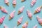 Colorful Assortment of Ice Cream Cones on Pastel Blue Background