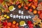 Colorful Autumn Decoration, Text Be Grateful, Wooden Background