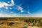 Colorful autumn forest against scenic cloudscape