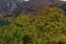 Colorful autumn   forest with coniferous and deciduous trees, glade and medieval fortress in the Balkan mountain, near Maglizh