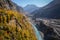 Colorful autumn in Hunza valley show blue river and Karakoram mountain range.
