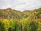 Colorful autumn landscape in the Carpathian Mountains, Romania. Autumn forest scenery