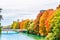 Colorful autumn landscape of Isar river in Munich, Bavaria - Ger