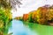 Colorful autumn landscape of Isar river in Munich, Bavaria - Ger