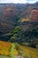 Colorful autumn landscape of oldest wine region in world Douro valley in Portugal, different varietes of grape vines growing on