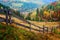 Colorful autumn landscape scene with fence in Transylvania