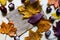 Colorful autumn leaves and chestnuts lying on jute coffee bag or sack. Yellow red and orange leaves and brown chestnuts isolated