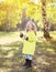 Colorful autumn photo, little child having fun