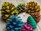 Colorful autumn pine cone art with small candle