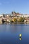 Colorful autumn Prague gothic Castle and Charles Bridge with the Lesser Town in the sunny Day, Czech Republic