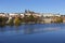 Colorful autumn Prague gothic Castle and Charles Bridge with the Lesser Town in the sunny Day, Czech Republic