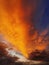 Colorful autumn sunset sky. Vertical background, abstract clouds shapes and colors. October seasonal celestial beauty. Panoramic