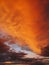 Colorful autumn sunset sky. Vertical background, abstract clouds shapes and colors. October seasonal celestial beauty. Panoramic