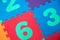 Colorful Baby Mat. Rubber foam pad for children playing. Colorful background ackground with digits.