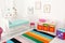 Colorful baby room interior with crib