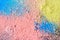 Colorful background of chalk powder. Multicolored dust particles splattered on black background