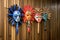 colorful balinese masks hanging on a bamboo wall