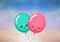 Colorful balloons with cute blushing faces against spots of light on gradient background