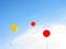 Colorful balloons flying in blue sky